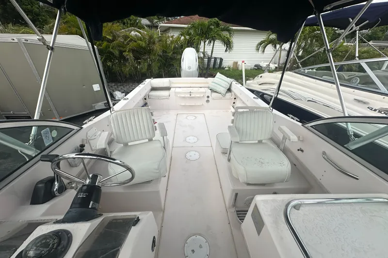 Slide: The Image of 1998 Grady-White Tournament 223 boat interior with seating and steering wheel. - 12