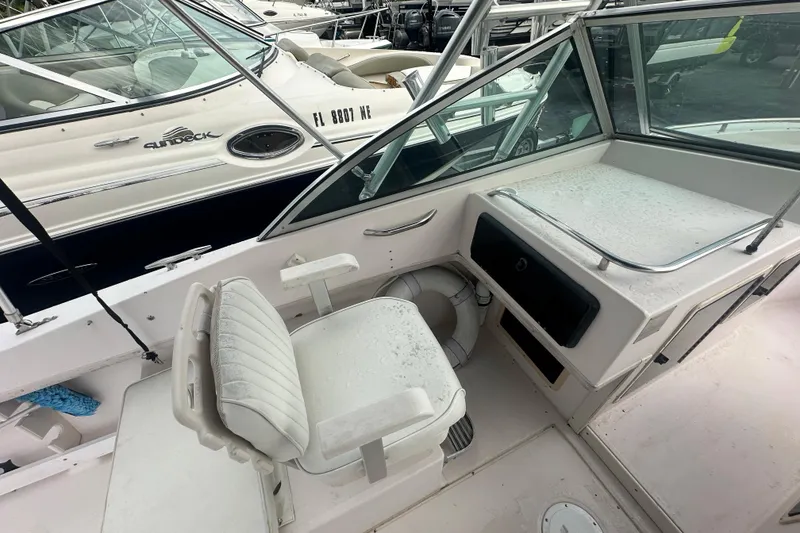 Slide: The Image of 1998 Grady-White Tournament 223 boat interior with seating and console. - 16