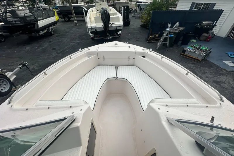 Slide: The Image of 1998 Grady-White Tournament 223 boat with spacious white seating area. - 17