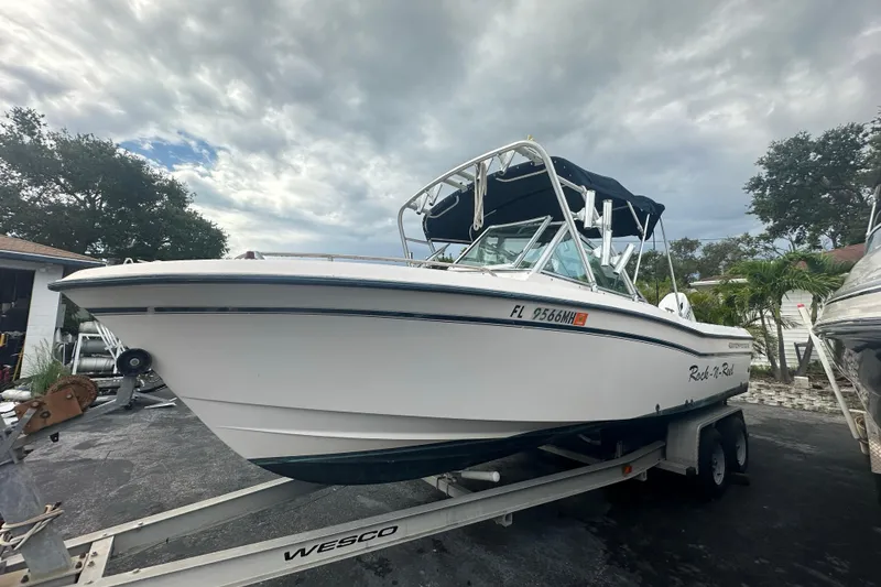 Slide: The Image of 1998 Grady-White Tournament 223 boat on trailer under cloudy sky. - 6