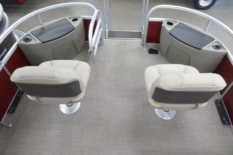 Slide: The Image of 2025 Sun Tracker Bass Buggy 18 DLX interior with two swivel seats and storage compartments. - 6