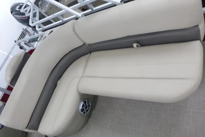 Slide: The Image of 2025 Sun Tracker Bass Buggy 18 DLX pontoon boat with beige seating and Mercury engine. - 7