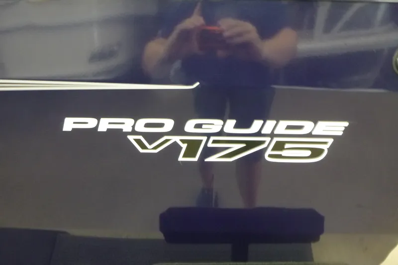 Slide: The Image of 2026 Tracker Pro Guide V-175 WT identification and emissions control labels. - 15