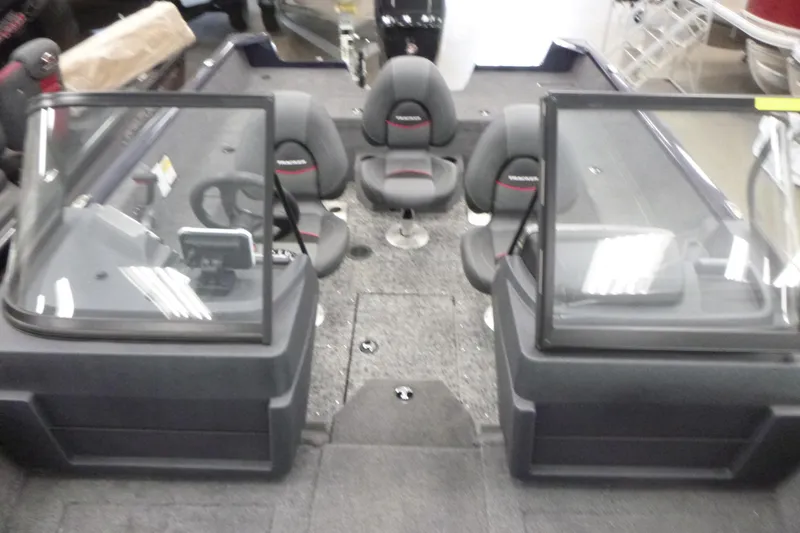 Slide: The Image of 2026 Tracker Pro Guide V-175 WT boat cockpit with steering wheel and control panel. - 4