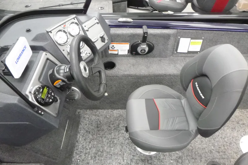 Slide: The Image of 2026 Tracker Pro Guide V-175 WT boat dashboard with steering wheel and Lowrance display. - 5