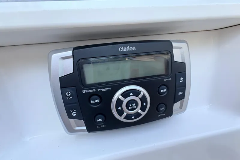 Slide: The Image of Clarion CMS2 stereo system on 2020 Chaparral 21 SSi boat dashboard. - 10
