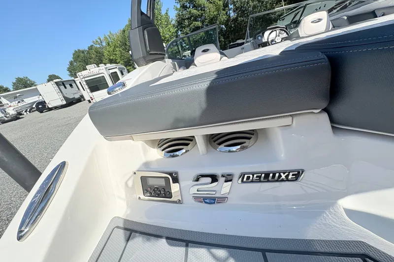 Slide: The Image of 2020 Chaparral 21 SSi Deluxe boat interior with seating and control panel. - 17