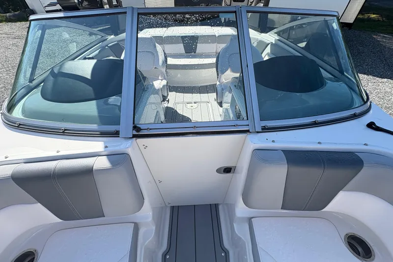 Slide: The Image of 2020 Chaparral 21 SSi boat interior with windshield and seating, viewed from above. - 8
