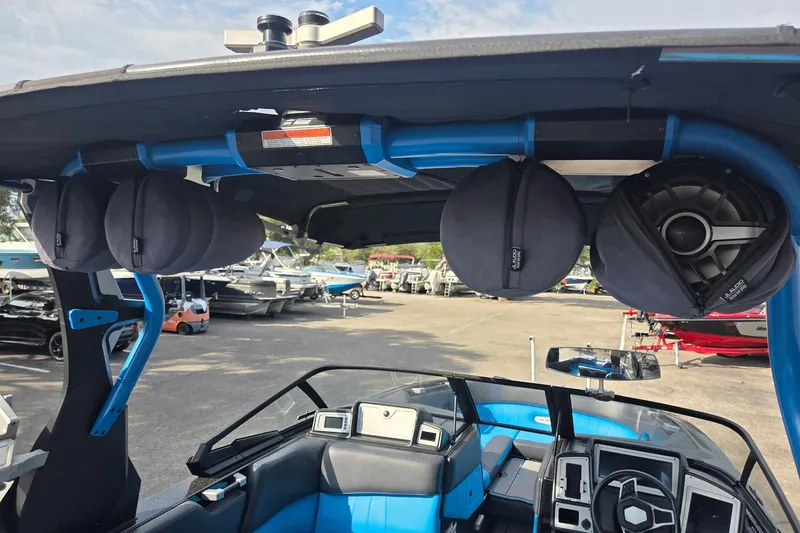 Slide: The Image of 2021 Supra SE 450 boat interior with speakers and blue accents. - 11