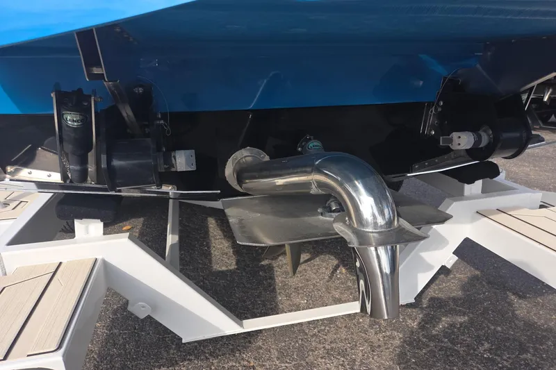 Slide: The Image of 2021 Supra SE 450 boat stern with propeller and exhaust system. - 16