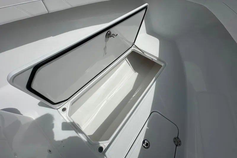Slide: The Image of Open storage compartment on 2026 Bluewater 25t boat, showcasing sleek design and functionality. - 10