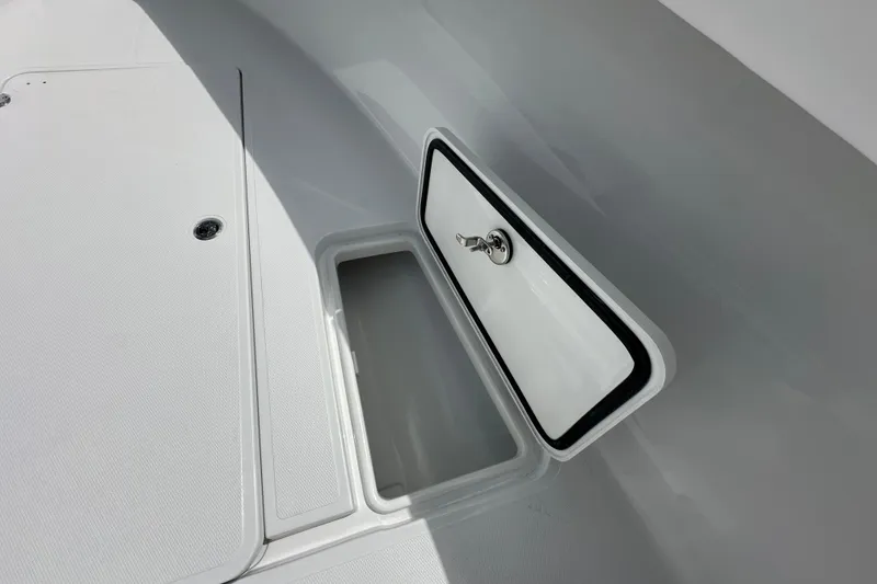 Slide: The Image of 2026 Bluewater 25t boat storage compartment with open hatch, showcasing sleek design. - 11