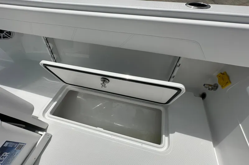 Slide: The Image of 2026 Bluewater 25t boat storage compartment with open hatch, showcasing sleek design. - 18