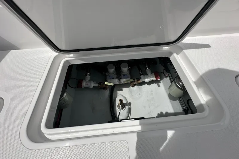 Slide: The Image of Open hatch of 2026 Bluewater 25t boat showing internal components and fittings. - 20