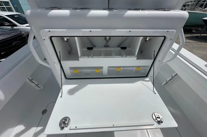 Slide: The Image of 2026 Bluewater 25t boat storage compartment with open hatch and organized interior. - 22