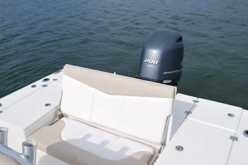 Slide: The Image of 2016 Robalo 226 Cayman boat with Yamaha 200 outboard motor on water. - 11