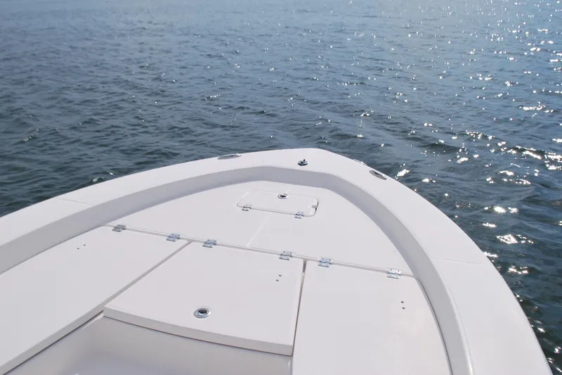 Slide: The Image of Bow of 2016 Robalo 226 Cayman boat on open water. - 3