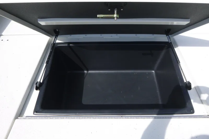 Slide: The Image of Open storage compartment of 2025 Ranger RB210 boat, showcasing spacious interior. - 11