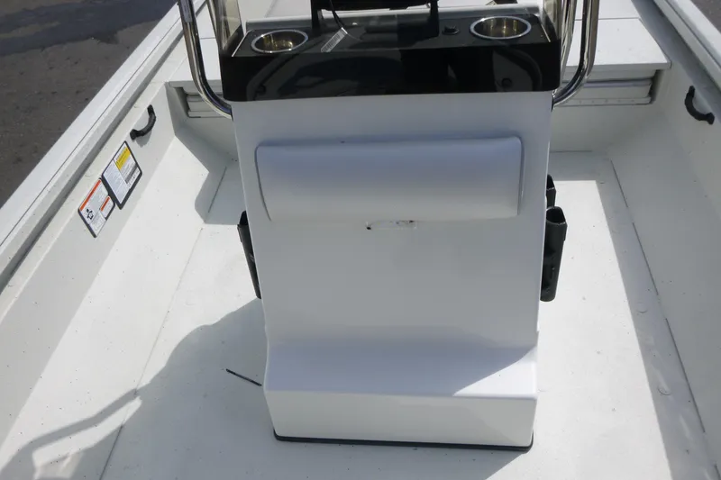 Slide: The Image of 2025 Ranger RB210 boat interior with console and cup holders. - 12