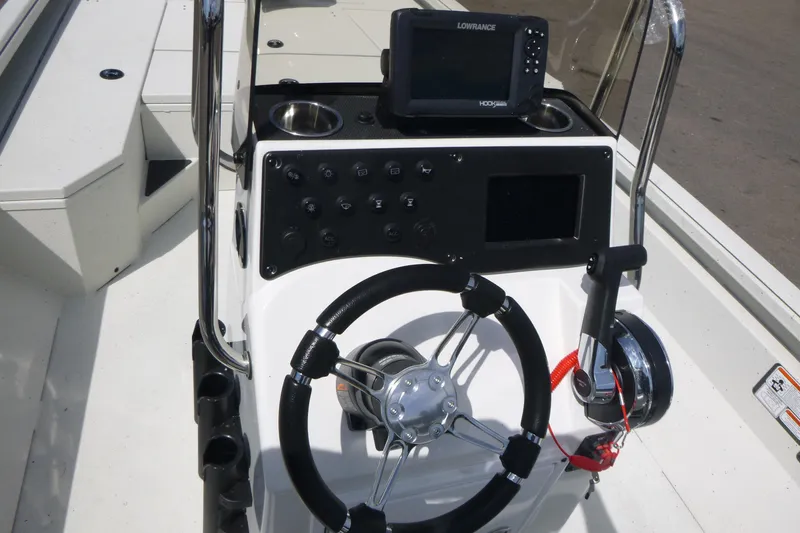 Slide: The Image of Ranger RB210 2025 boat console with steering wheel and navigation system. - 14