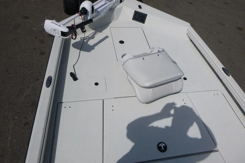 Slide: The Image of 2025 Ranger RB210 boat deck with white seating and trolling motor. - 6