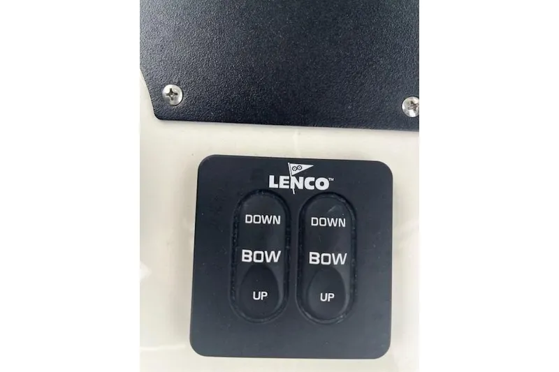 Slide: The Image of Lenco trim tab control panel on 2021 Mako 214 CC boat dashboard. - 3