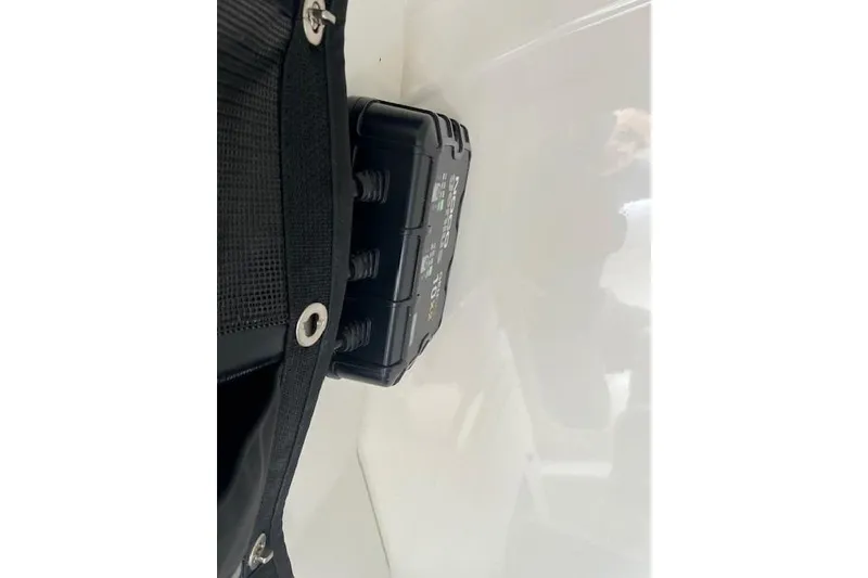 Slide: The Image of Black storage compartment on 2021 Mako 214 CC boat interior. - 5