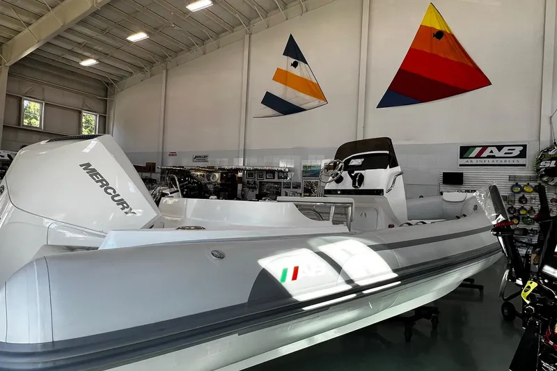 Slide: The Image of 2024 AB Inflatables Oceanus 21 VST boat in showroom with Mercury engine. - 1