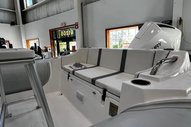 Slide: The Image of 2024 AB Inflatables Oceanus 21 VST boat interior with seating and Mercury engine. - 3
