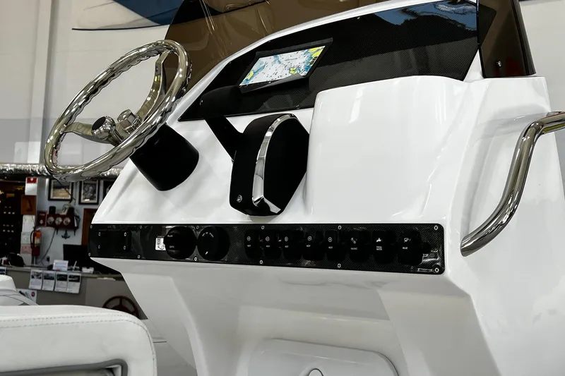 Slide: The Image of 2024 AB Inflatables Oceanus 21 VST dashboard with steering wheel and control panel. - 7