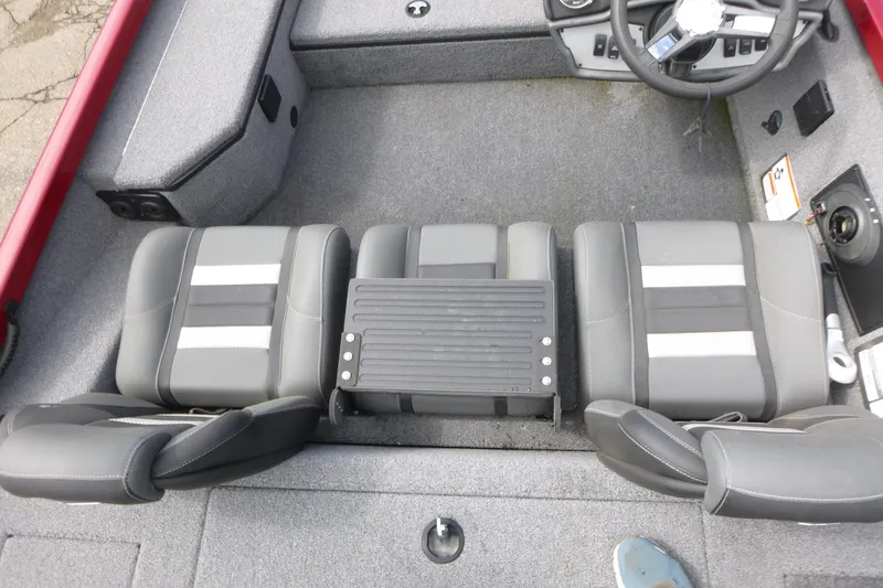 Slide: The Image of 2024 Ranger RT178 boat interior with gray seating and steering wheel. - 10