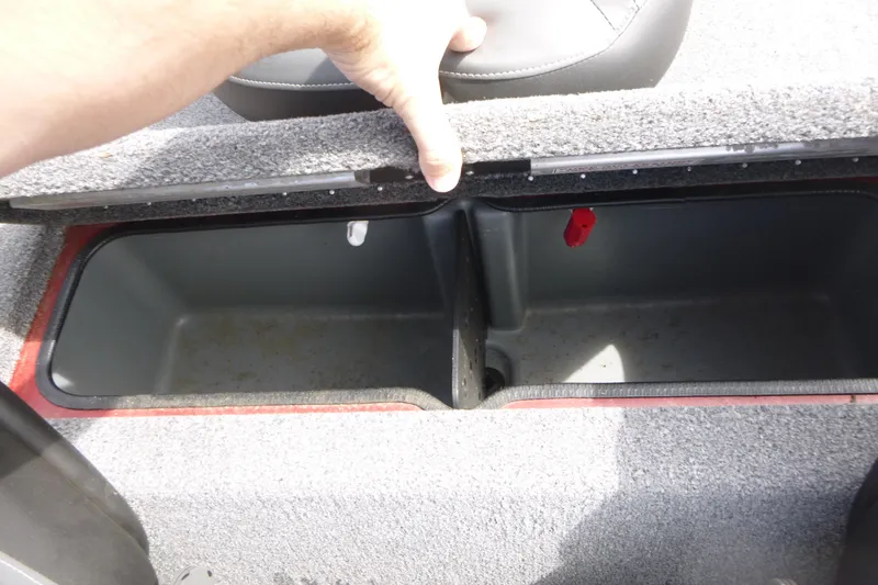 Slide: The Image of 2024 Ranger RT178 boat storage compartment with open lid, showcasing interior space. - 14