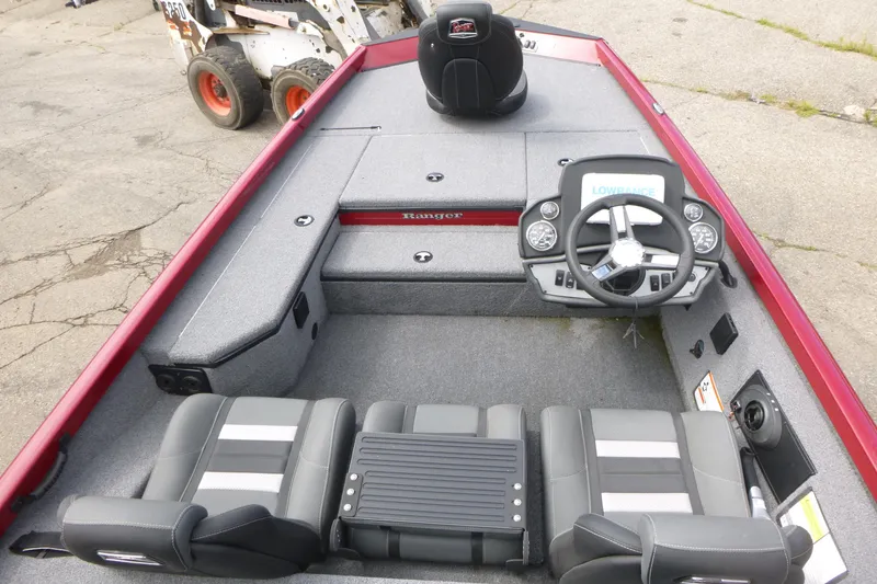 Slide: The Image of 2024 Ranger RT178 boat interior with steering wheel and seating, featuring a red and gray design. - 5