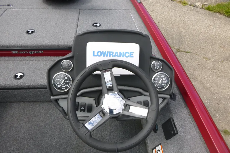 Slide: The Image of 2024 Ranger RT178 boat dashboard with Lowrance display and steering wheel. - 8