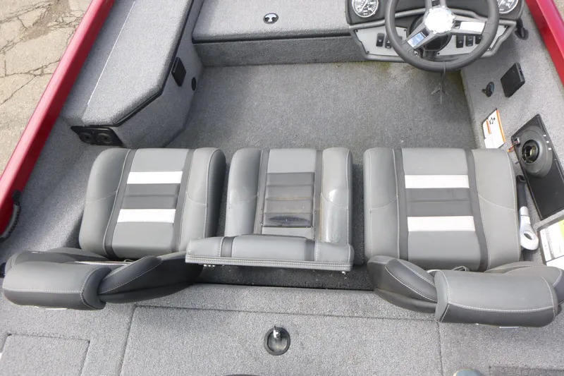 Slide: The Image of 2024 Ranger RT178 boat interior with gray seating and steering wheel. - 9