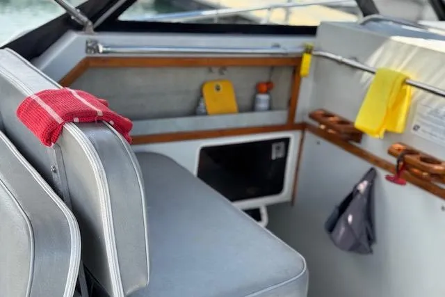 Slide: The Image of 1988 Penn Yan Predator 288 boat interior with seating and storage compartments. - 10