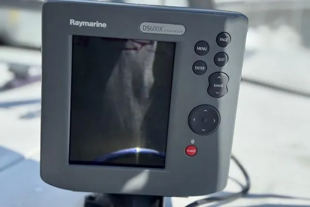 Slide: The Image of Raymarine DS600X fishfinder on 1988 Penn Yan Predator 288 boat dashboard. - 13