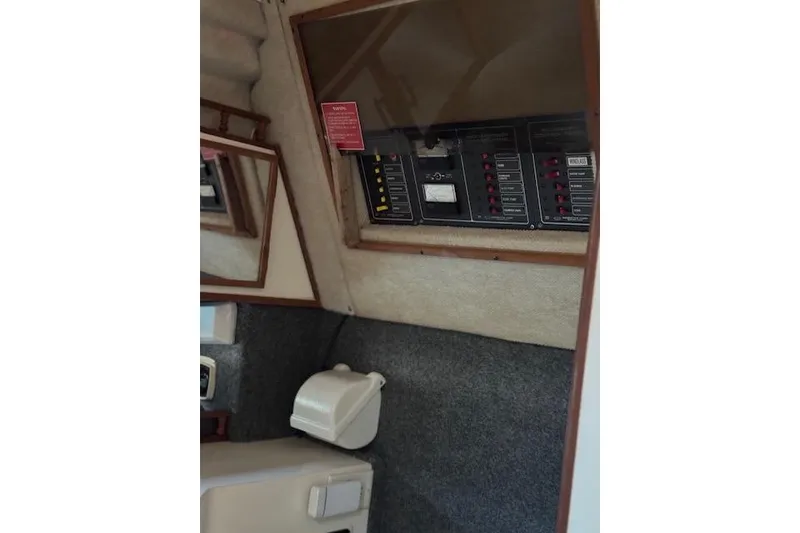 Slide: The Image of Interior of 1988 Penn Yan Predator 288 boat showing control panel and cabin features. - 17