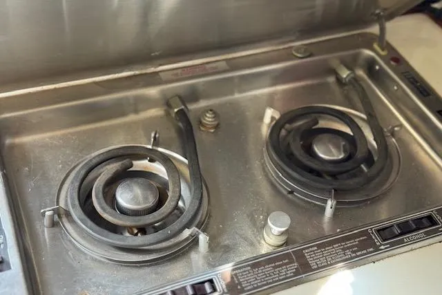 Slide: The Image of Two-burner electric stove in a 1988 Penn Yan Predator 288 boat kitchen. - 22