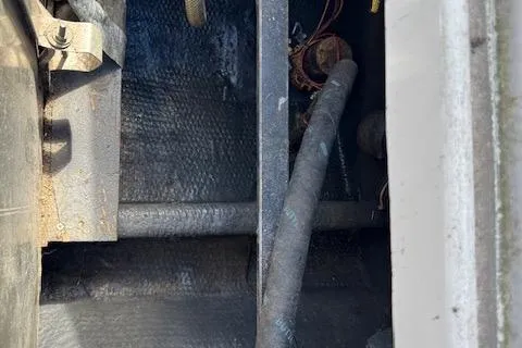 Slide: The Image of 1988 Penn Yan Predator 288 engine compartment with visible wiring and hoses. - 26