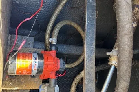 Slide: The Image of 1988 Penn Yan Predator 288 boat interior showing Seaflo pump and wiring. - 27