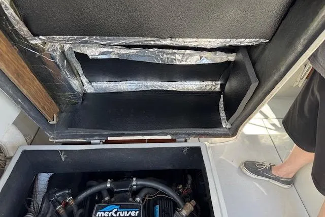 Slide: The Image of 1988 Penn Yan Predator 288 engine compartment with MerCruiser engine visible. - 29