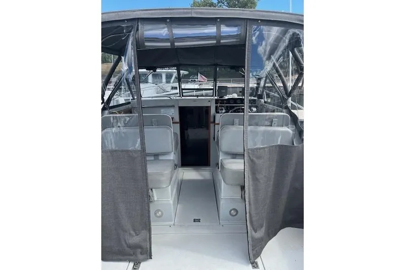 Slide: The Image of 1988 Penn Yan Predator 288 boat interior with seating and covered cockpit. - 36