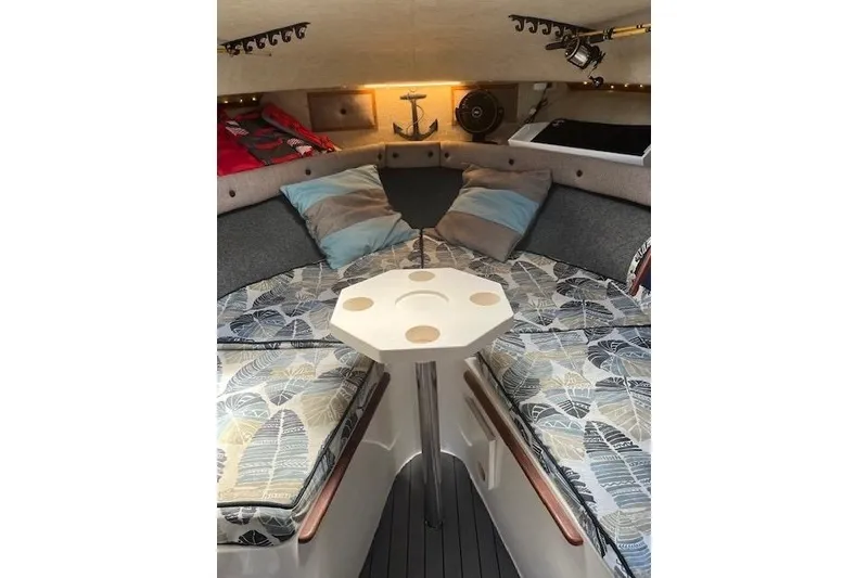 Slide: The Image of 1988 Penn Yan Predator 288 cabin interior with cushions and table. - 39