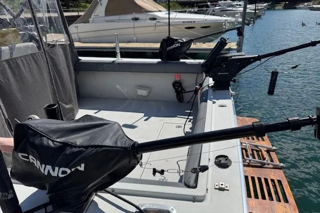 Slide: The Image of 1988 Penn Yan Predator 288 boat with fishing equipment at a marina. - 7