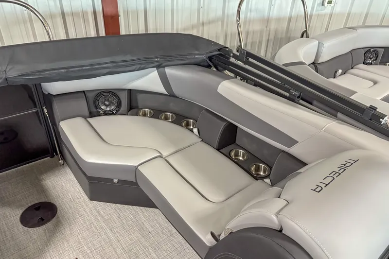Slide: The Image of Luxurious seating area in 2025 Trifecta 22 RF CS boat with cup holders and speaker. - 11
