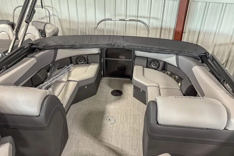 Slide: The Image of 2025 Trifecta 22 RF CS pontoon boat interior with luxurious seating and modern design. - 12