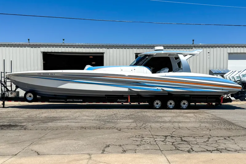 Slide: The Image of 2023 MTI 50 V boat on trailer, parked outside industrial building. - 14