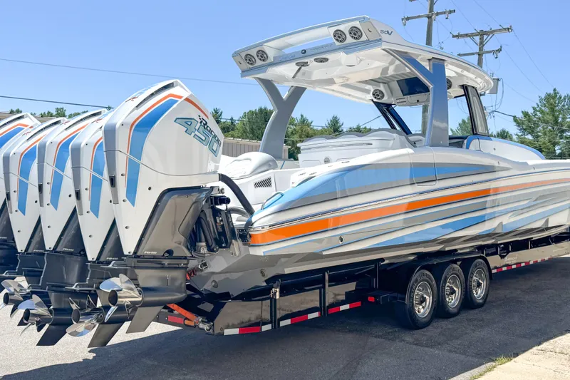 Slide: The Image of 2023 MTI 50 V boat with quad 450R engines on a trailer. - 18