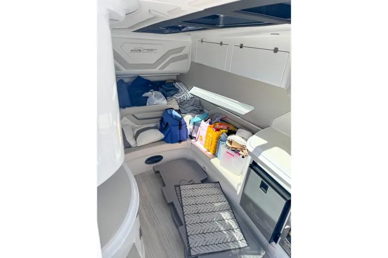 Slide: The Image of Interior of 2023 MTI 50 V boat cabin with storage and seating area. - 8